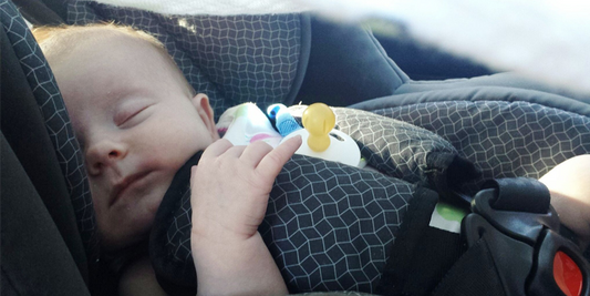 Image of a Baby Asleep In A Car Seat